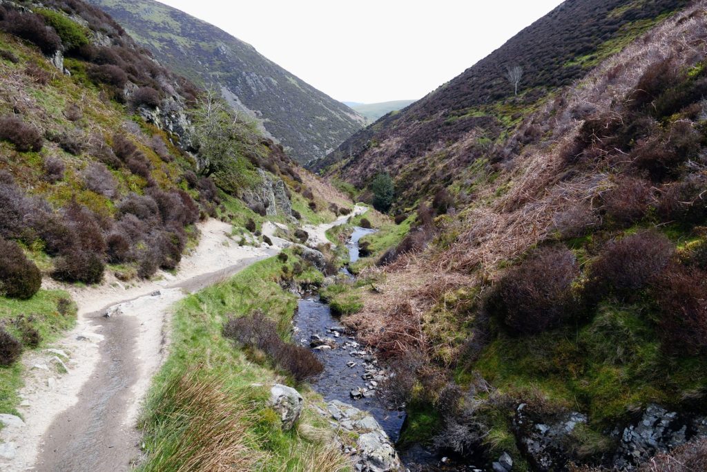 When God Asks You to Do the Hard Thing_stream and road in rugged mountains