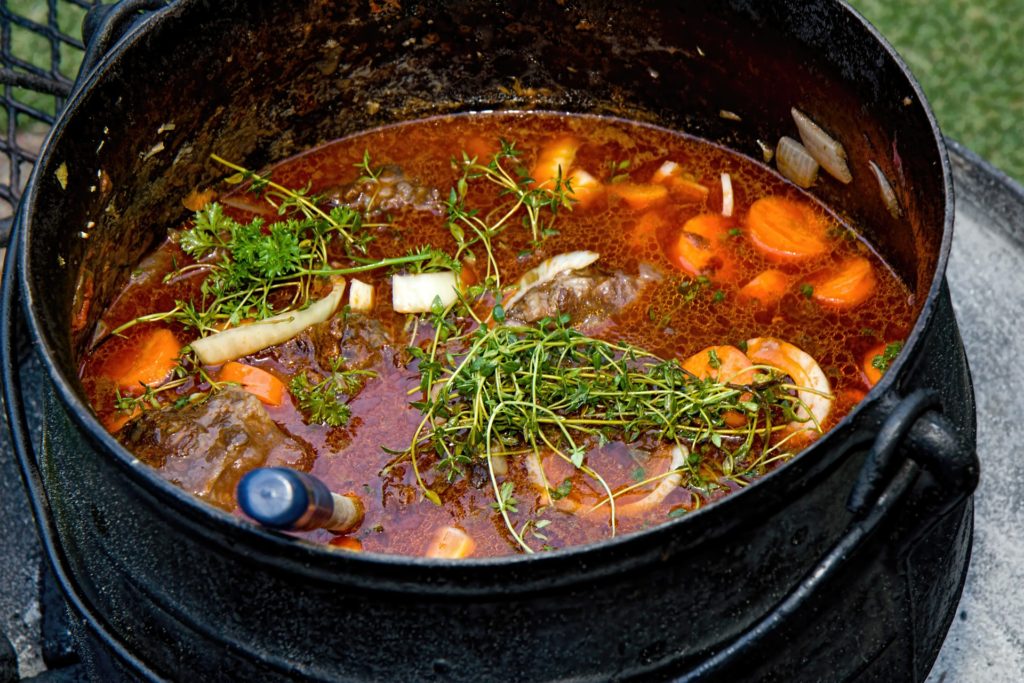 Purify Us, Oh God_vegetable stew in large black pot, herbs on top