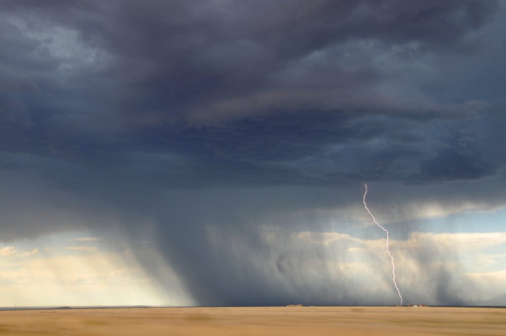 How to Know God Is Our Refuge_tornado forming, sweeping across open golden field